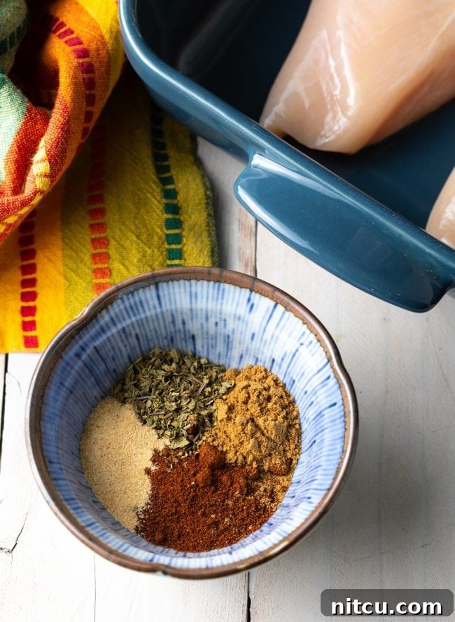A small bowl filled with the vibrant chipotle seasoning mix.