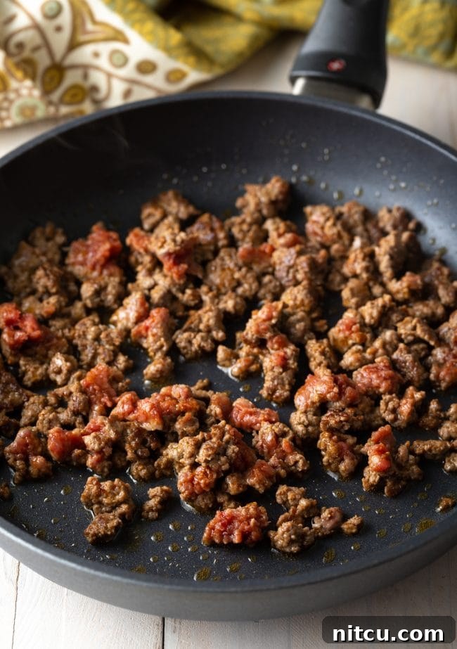 Kifto being sautéed gently in a skillet, turning into 'lebleb'.
