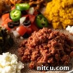 Close-up of freshly prepared Kitfo in a bowl.