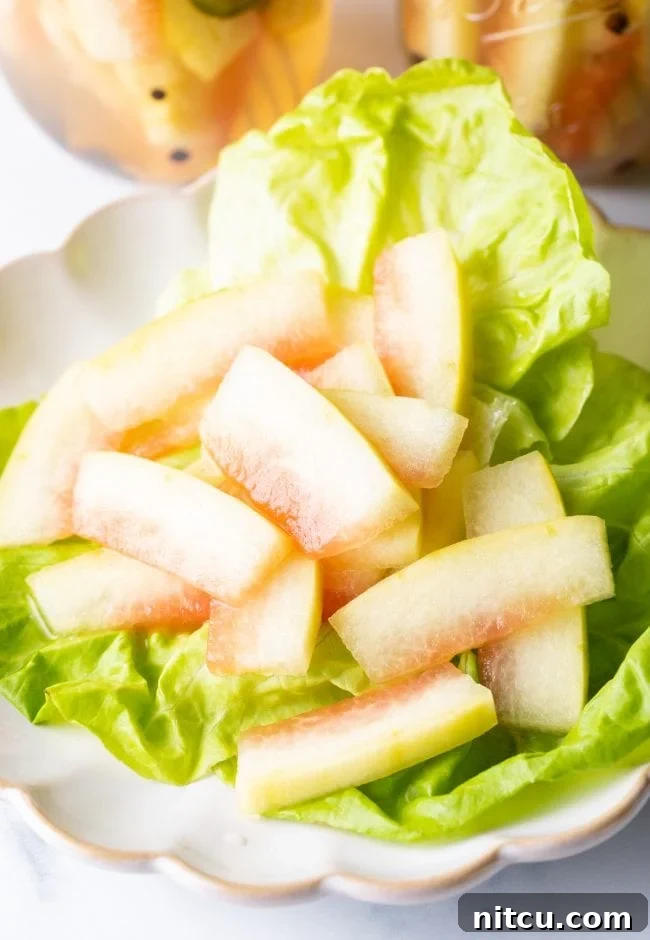 watermelon pickles on a bed of lettuce