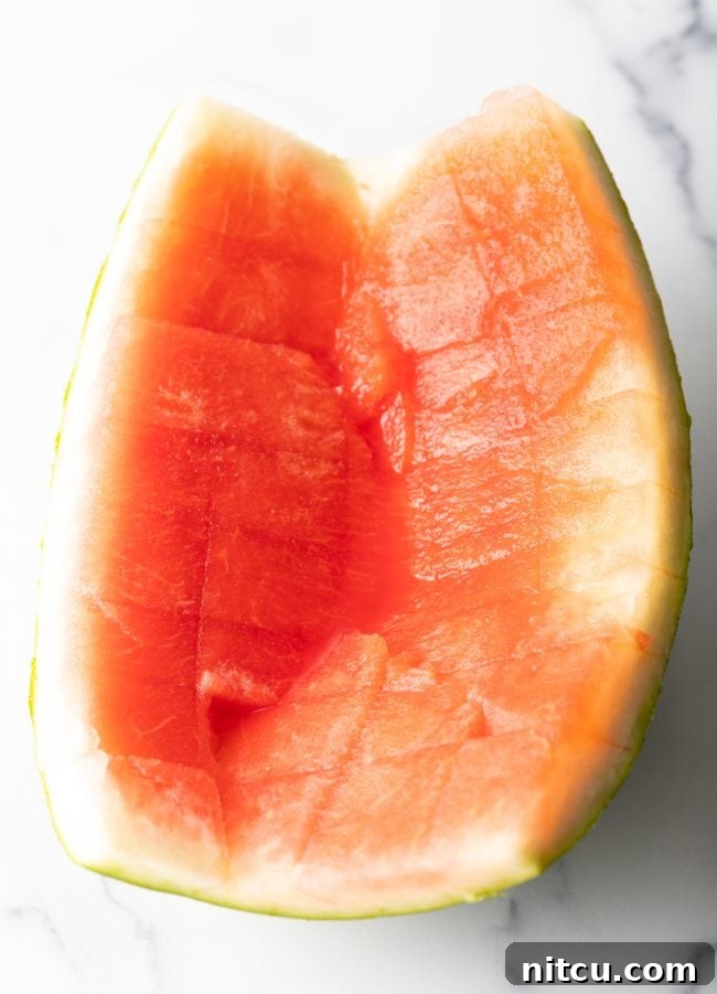 rind from a freshly cut watermelon with just a bit of pink flesh on it.