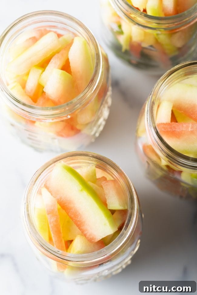filling the jars with melon rind slices