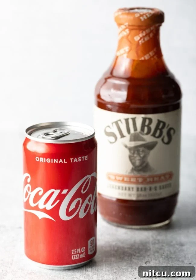 Classic Coca-Cola can and a bottle of rich Stubb's B-B-Q sauce, key ingredients for our burnt ends recipe.