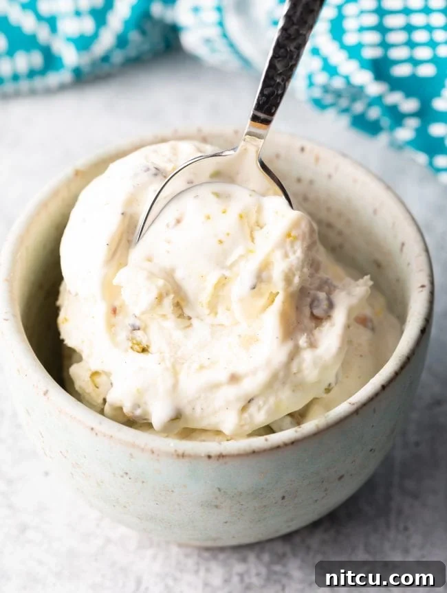 spoon scooping kulfi ice cream from a bowl