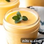 Dairy-Free Mango Pudding garnished with fresh mint
