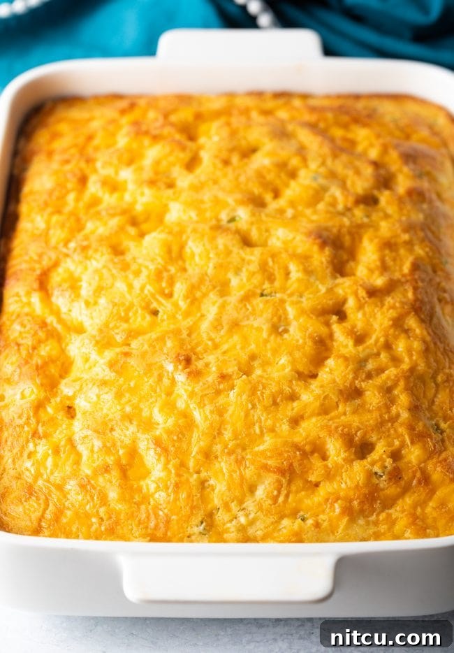 Freshly baked jalapeno cheddar cornbread, golden brown and bubbling with cheese.