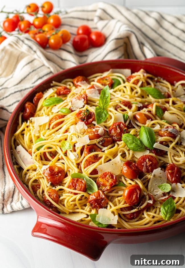 A beautiful bowl of spaghetti tossed with homemade roasted cherry tomato pasta sauce.