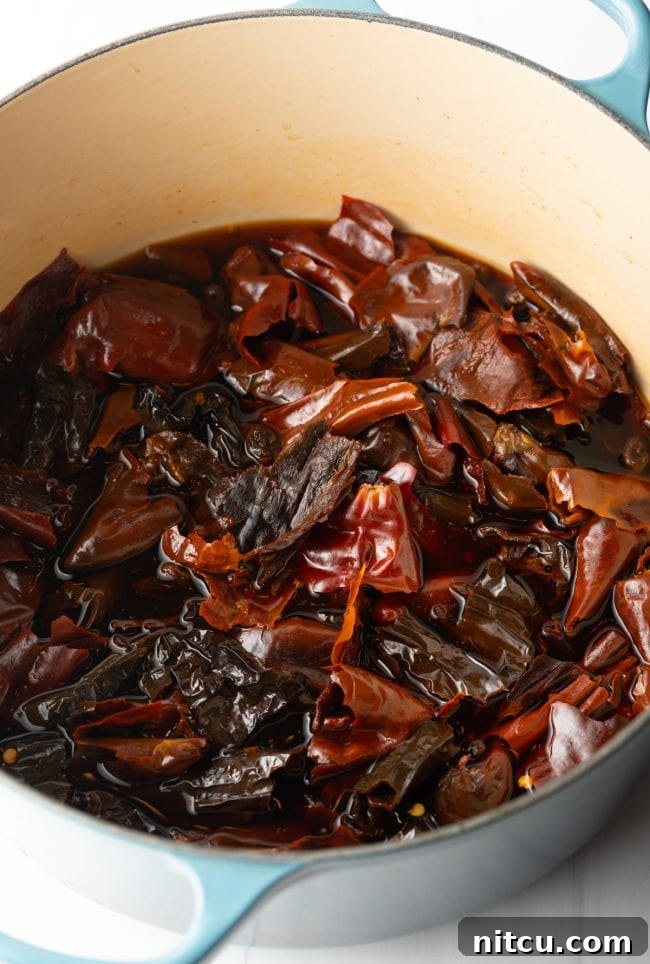 pot with steeped red chiles and raisins