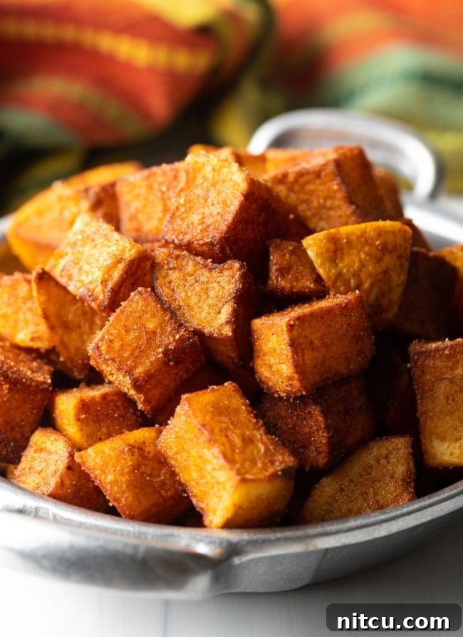 Close-up view of golden brown, crunchy Patatas Bravas (Mexican Potatoes)