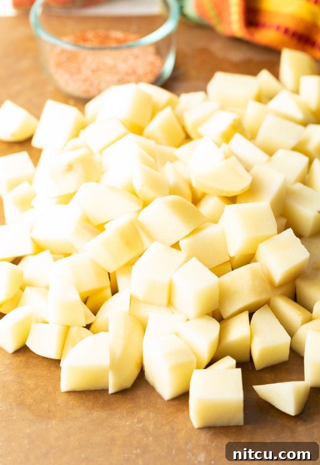 Peeled and uniformly chopped russet potatoes, ready for frying
