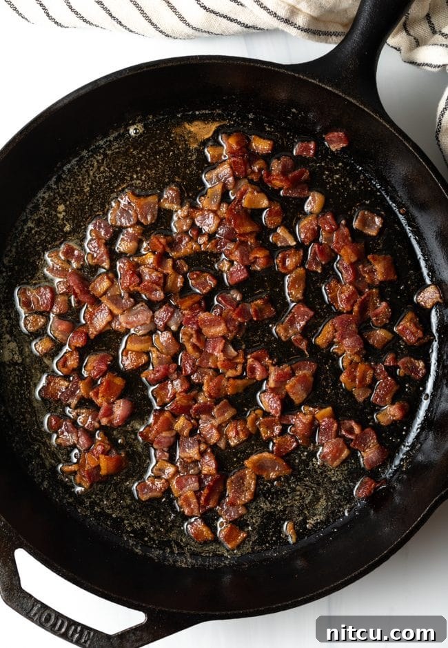 skillet with chopped cooked bacon