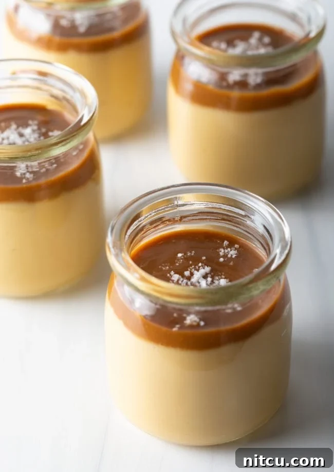 Italian Dessert Recipes - jars filled with homemade butterscotch pudding topped with caramel and sea salt
