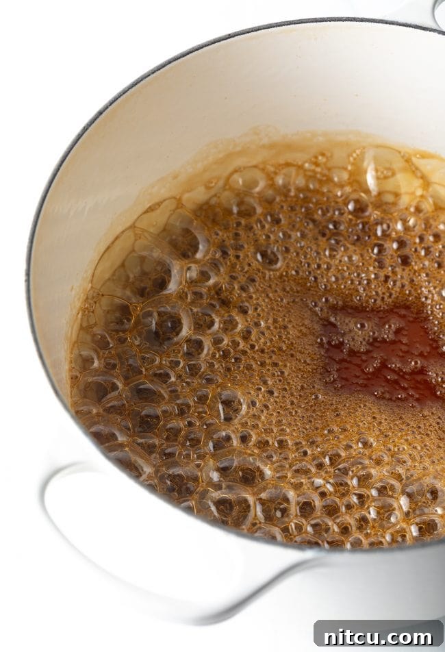 large pot with water and sugar simmering