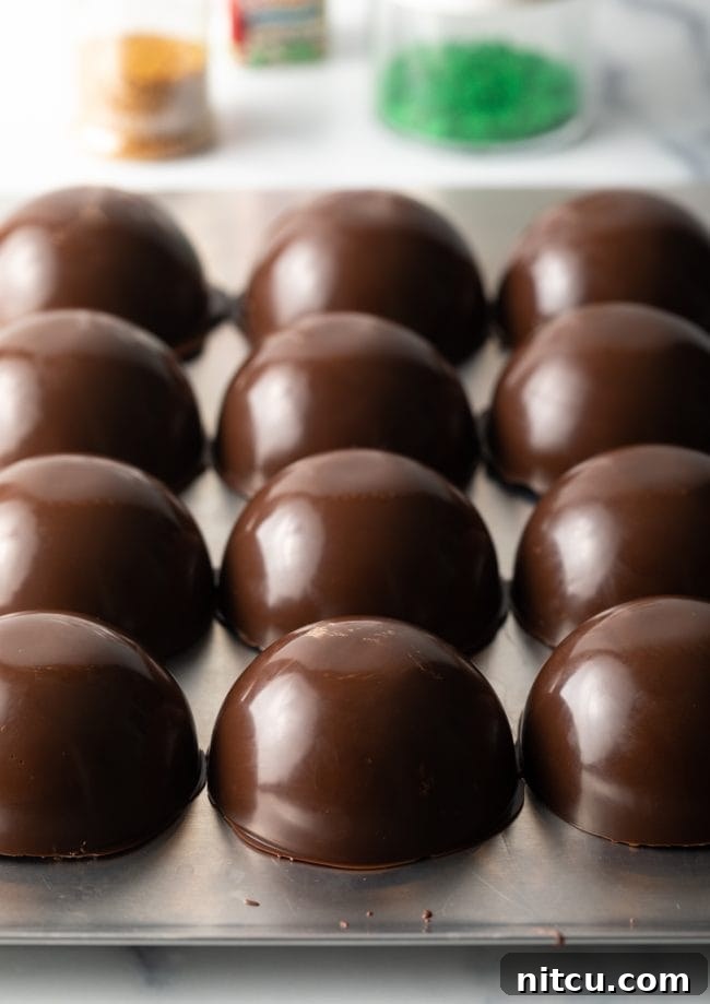 Ready chocolate half spheres removed from mold.