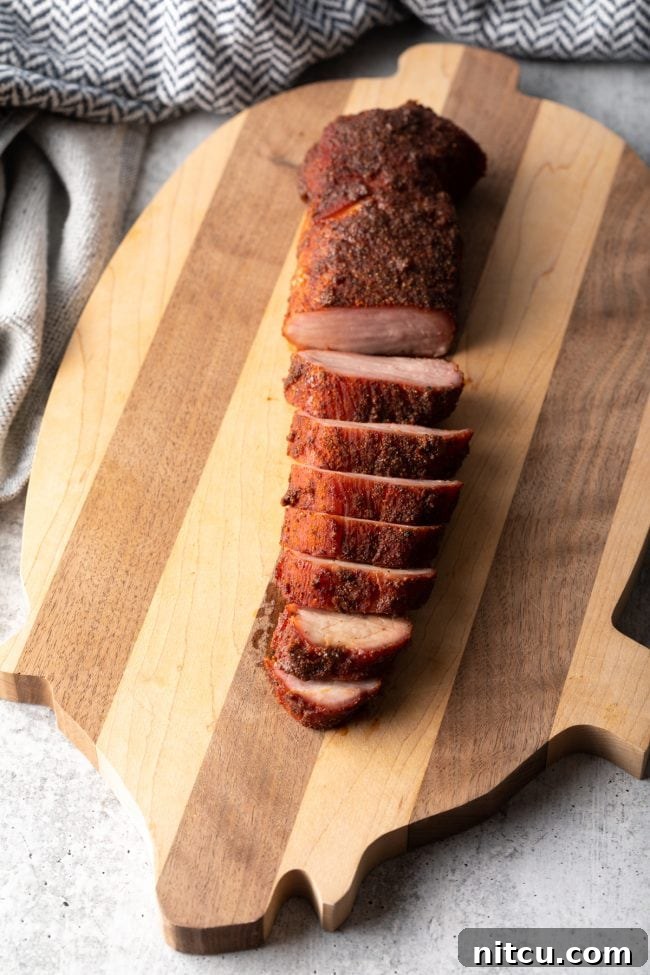 top view sliced pork tenderloin on a cutting board