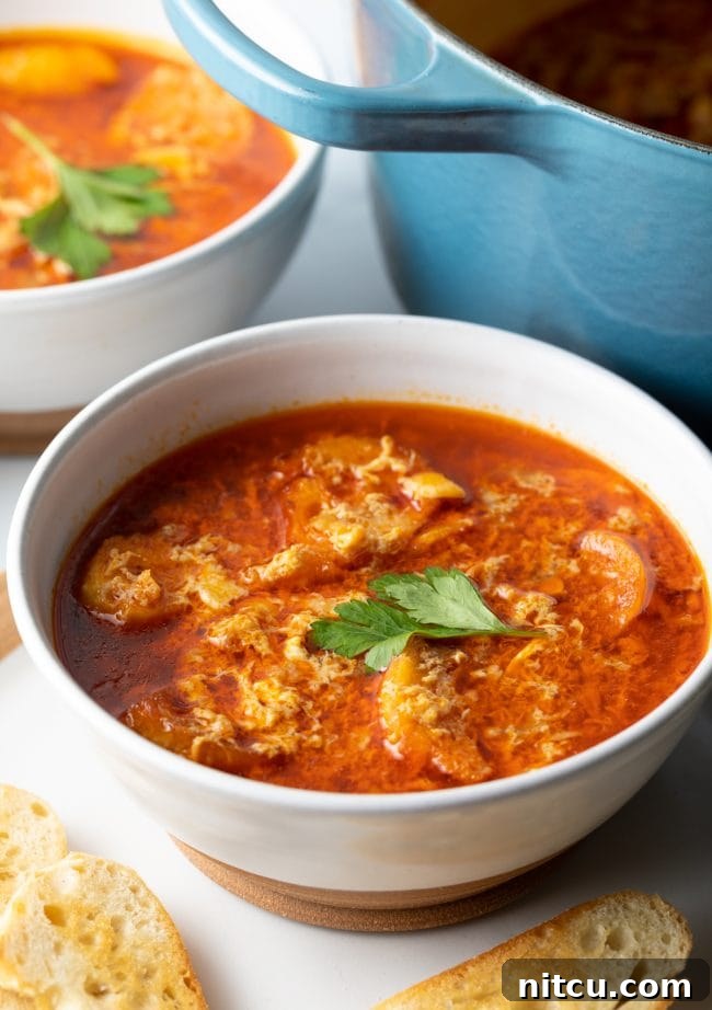 Spanish Soup (Sopa De Ajo) - bowl of sopa de ajo with fresh parsley on top