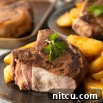 cut shot showing juicy inside of sous vide pork chop
