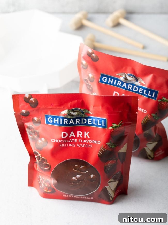 Two bags of premium Ghirardelli dark chocolate melting wafers are neatly displayed, ready to be transformed into a delicious breakable heart.