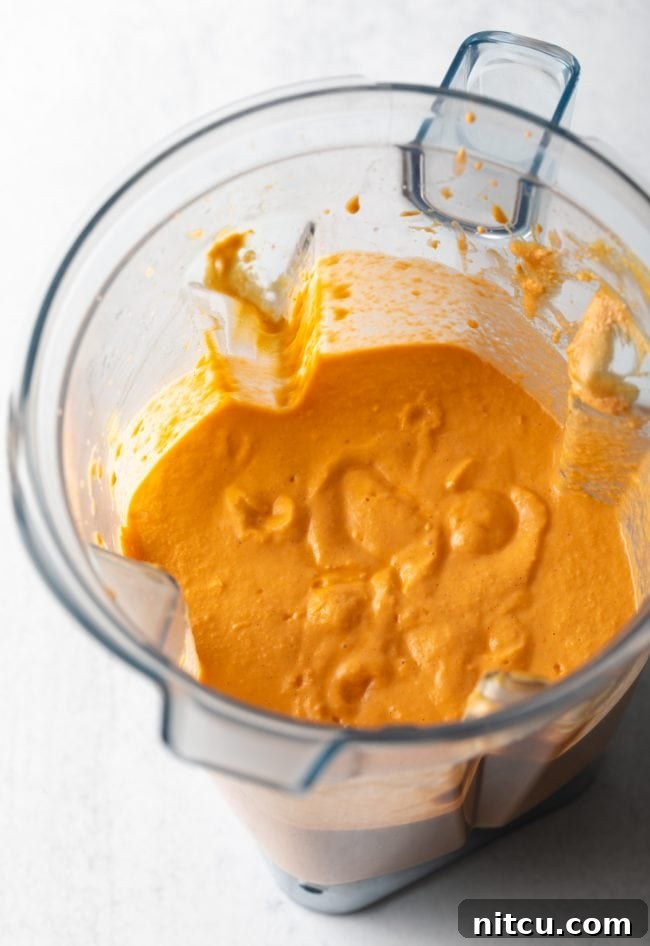 The blended ingredients, now a smooth, creamy purée, inside the blender.