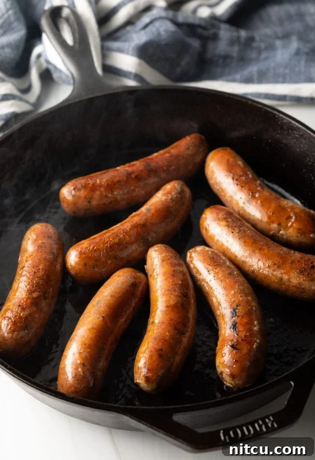 Sausages being grilled on sauteed. 