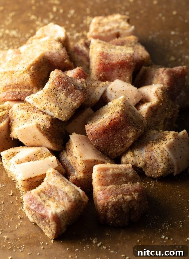 Expertly seasoned pork belly bites, coated in a rich dry rub.