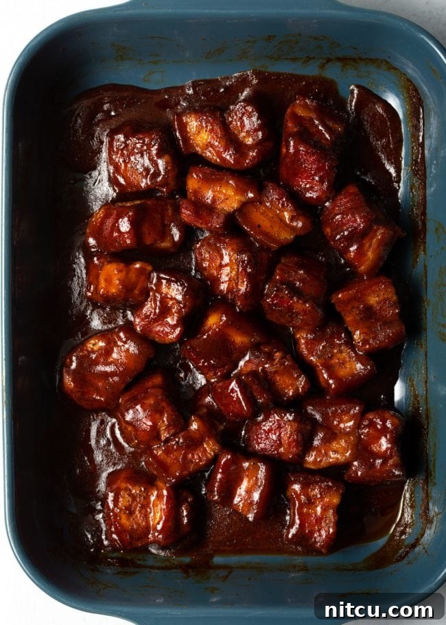 Oven roasted pork belly burnt ends, sticky and caramelized.