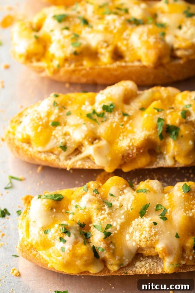 Freshly baked Salty Dog Cafe-style shrimp toast on a baking sheet, with golden melted cheese and crispy edges.