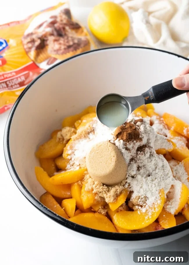 Mixing peaches with sugar and spices for the pie filling.