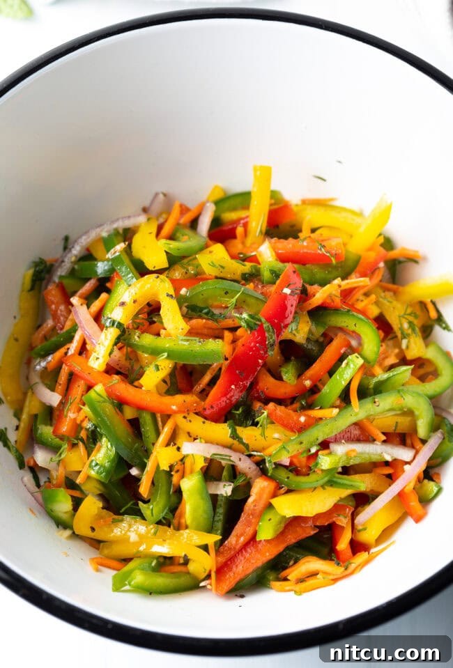 Close-up of a vibrant bell pepper salad, highlighting the crisp textures and fresh herbs, ready to be enjoyed.