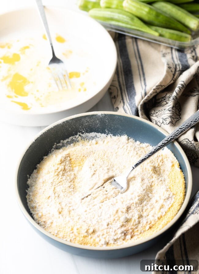 Breading mixed in a bowl with fork.