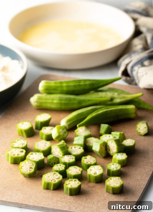 Chopped fresh okra on a cutting board.