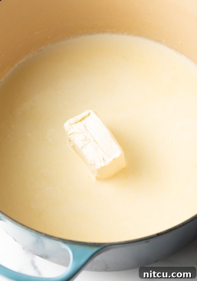 Butter melting in a large Dutch oven on the stovetop, starting the roux.