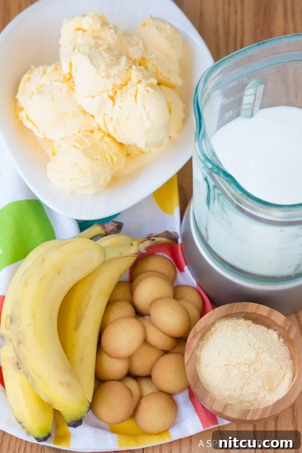 Blender filled with ingredients for a homemade Banana Pudding Milkshake
