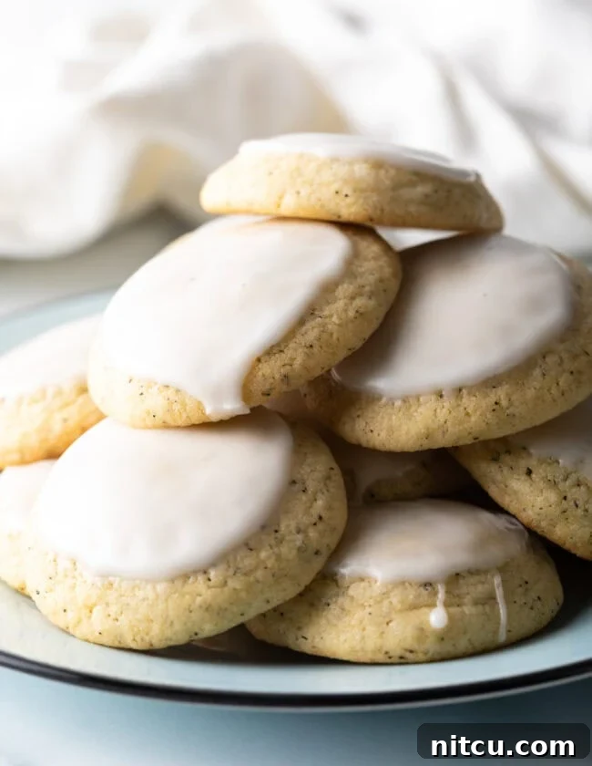 EARL GREY COOKIES - Stack of soft tea cakes with lemon glaze, beautifully presented.