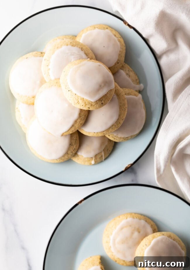 Plates stacked with freshly baked Earl Grey tea cookies, each delicately finished with a lemon glaze.