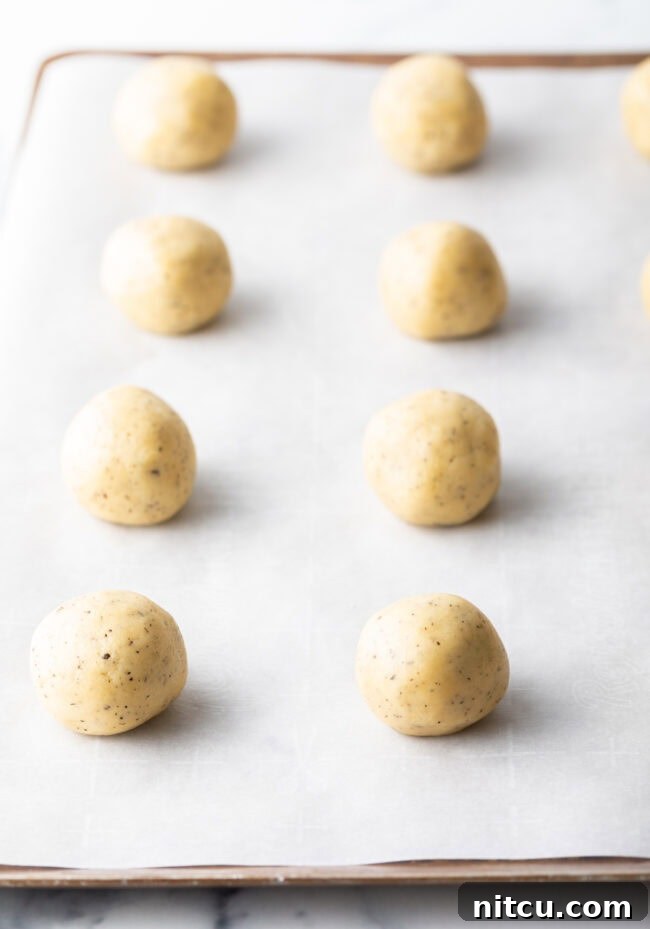 Mixing butter and sugar in a stand mixer for cookie dough.