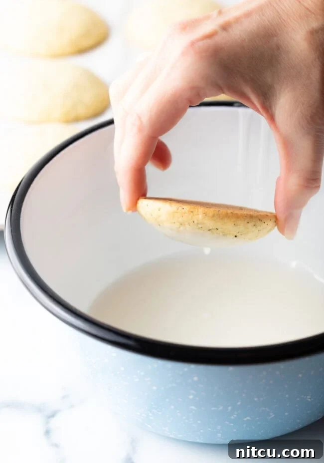 Rolling cookie dough into uniform balls before baking.
