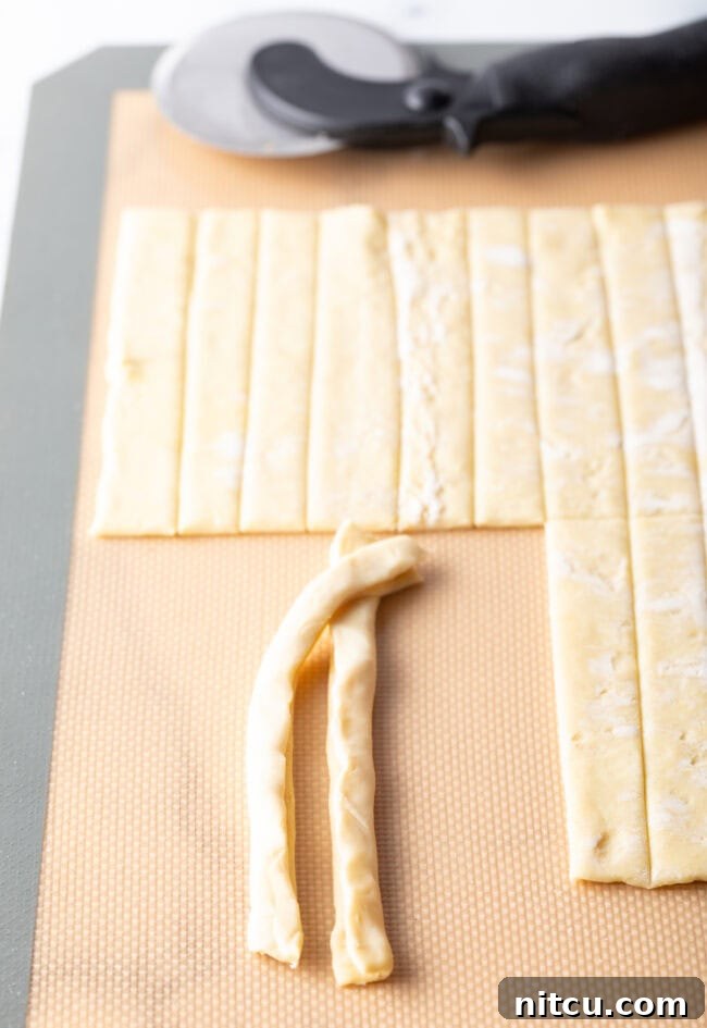 Two pieces of puff pastry beginning to thread. 