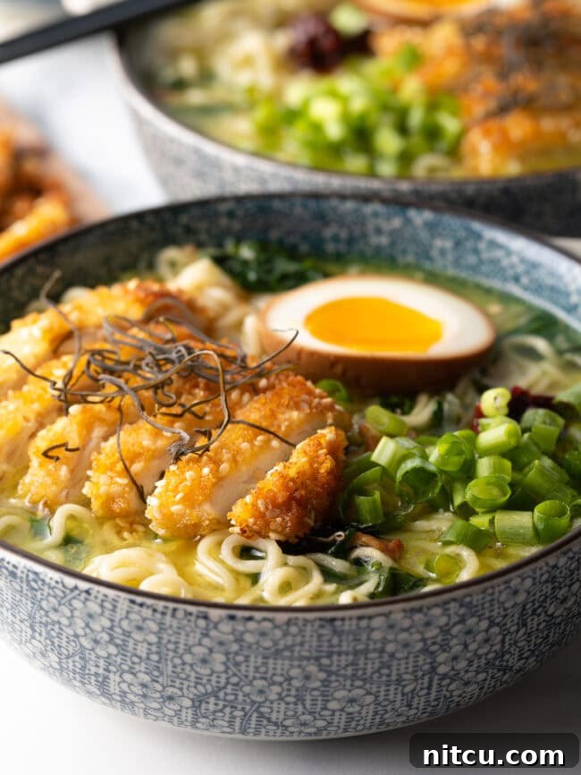 Side view of katsu chicken Ramen bowls loaded with goodies.