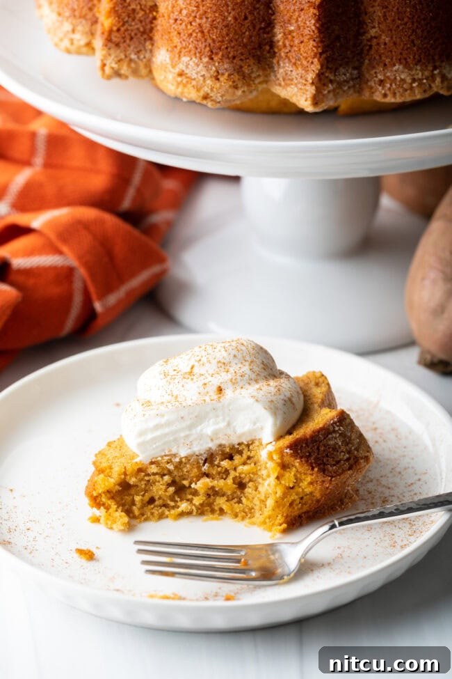 The final shot of the sweet potato pound cake recipe, with a delectable slice on a plate and a bite taken out, inviting you to taste.