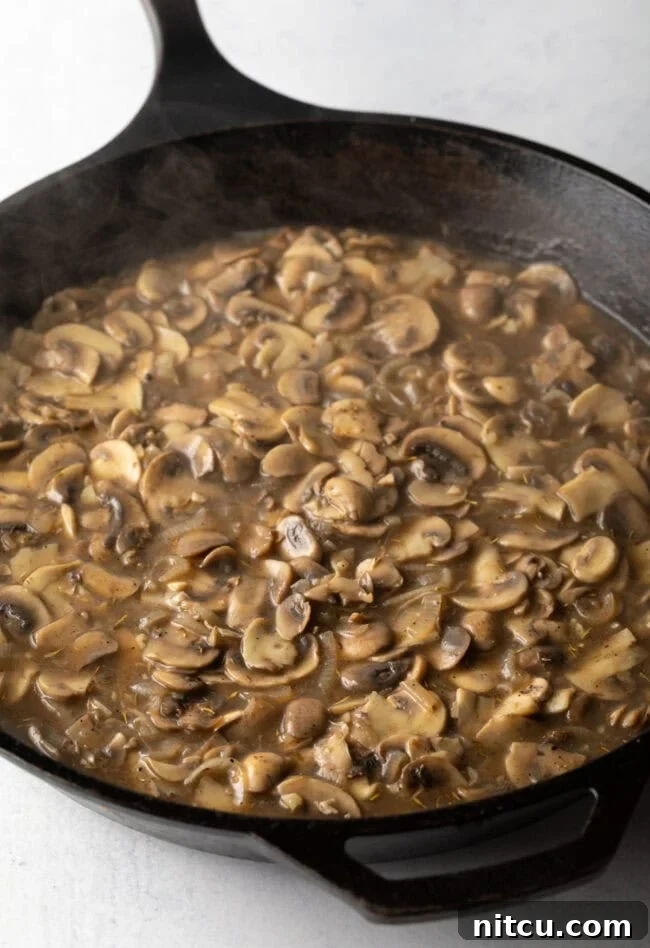 Cast iron pan with mushroom sauce.