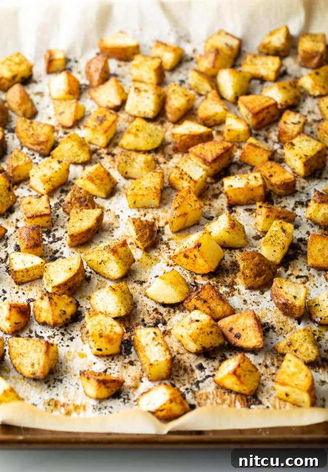 Russet Potato Recipe - Chopped baked russet potatoes on a baking sheet.