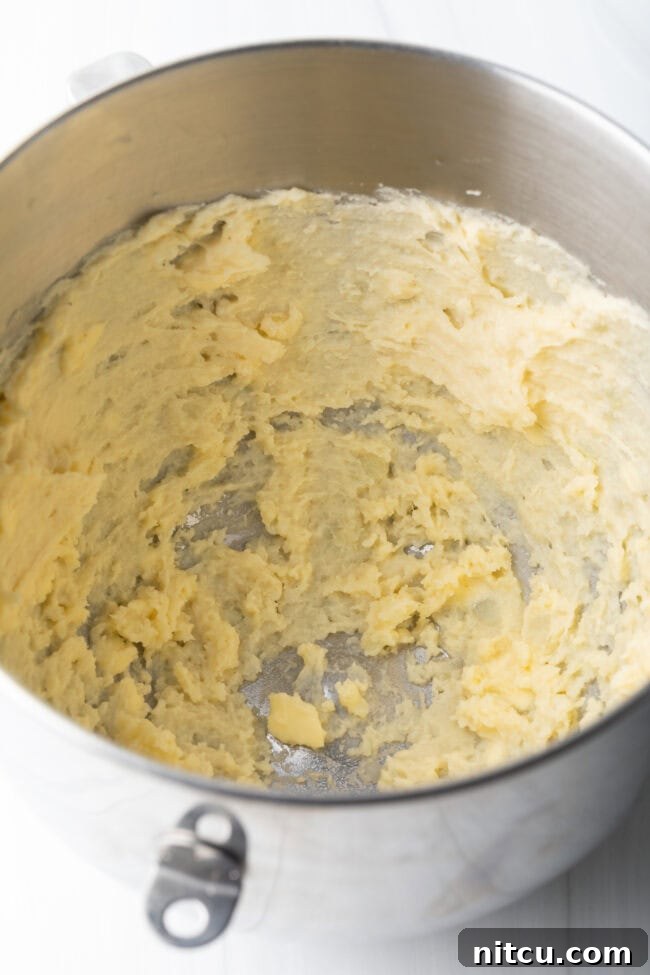 Mixing bowl with beaten mashed potatoes.