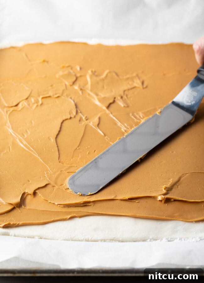 Spreading peanut butter across