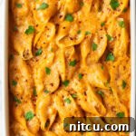 Top down view baked stuffed shells seafood pasta.