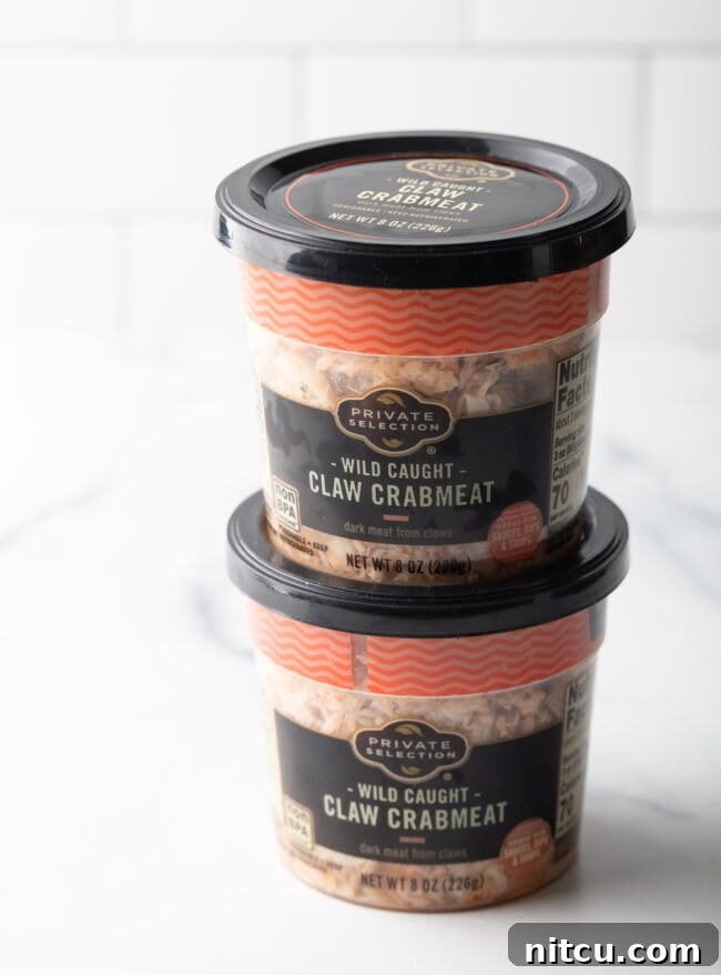 Two containers of crab claw meat.