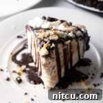 Slice of chocolate Duke's Hula Pie on a white plate.