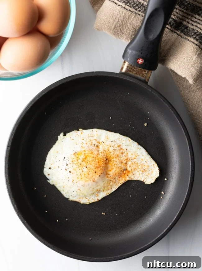 Cooked over easy egg with spices.