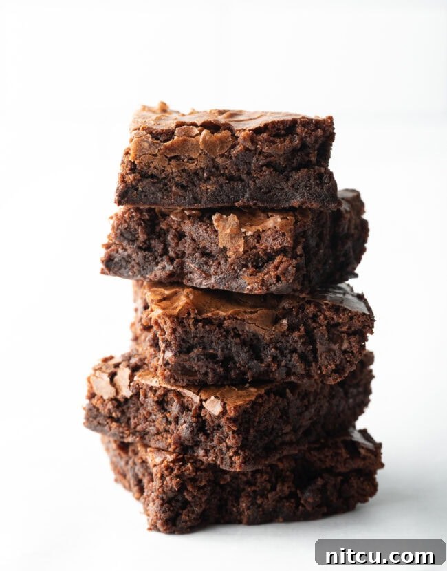 Stack of 5 box brownies on a white background.