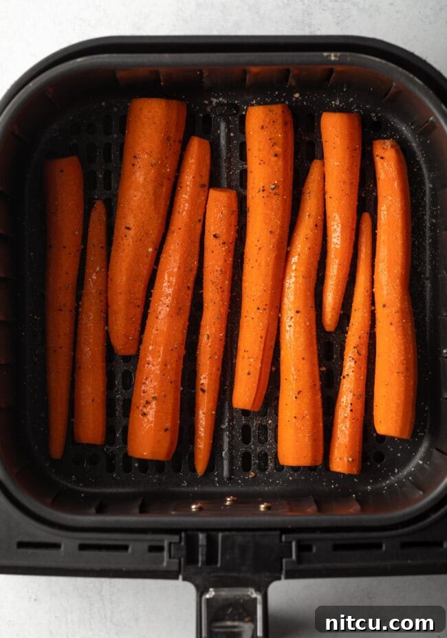 Whole raw carrots in the basket.